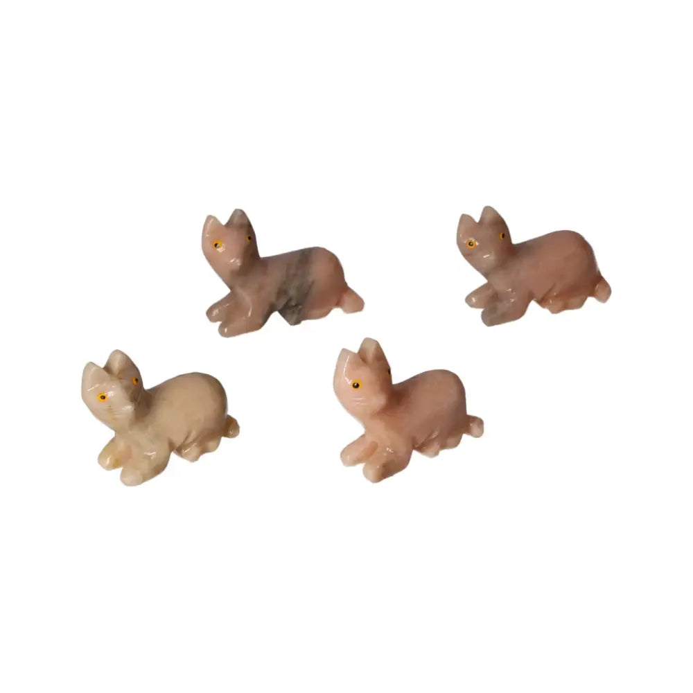 Elegant carved dolomite cats, perfect for enhancing emotional stability and luxury decor, from Sylvia Crystals, set of four.