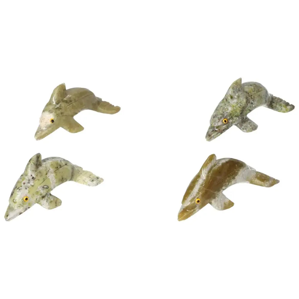 Elegant carved dolomite dolphin figurines, crafted from Sylvia Crystals, showcasing exquisite design and calming metaphysical properties.