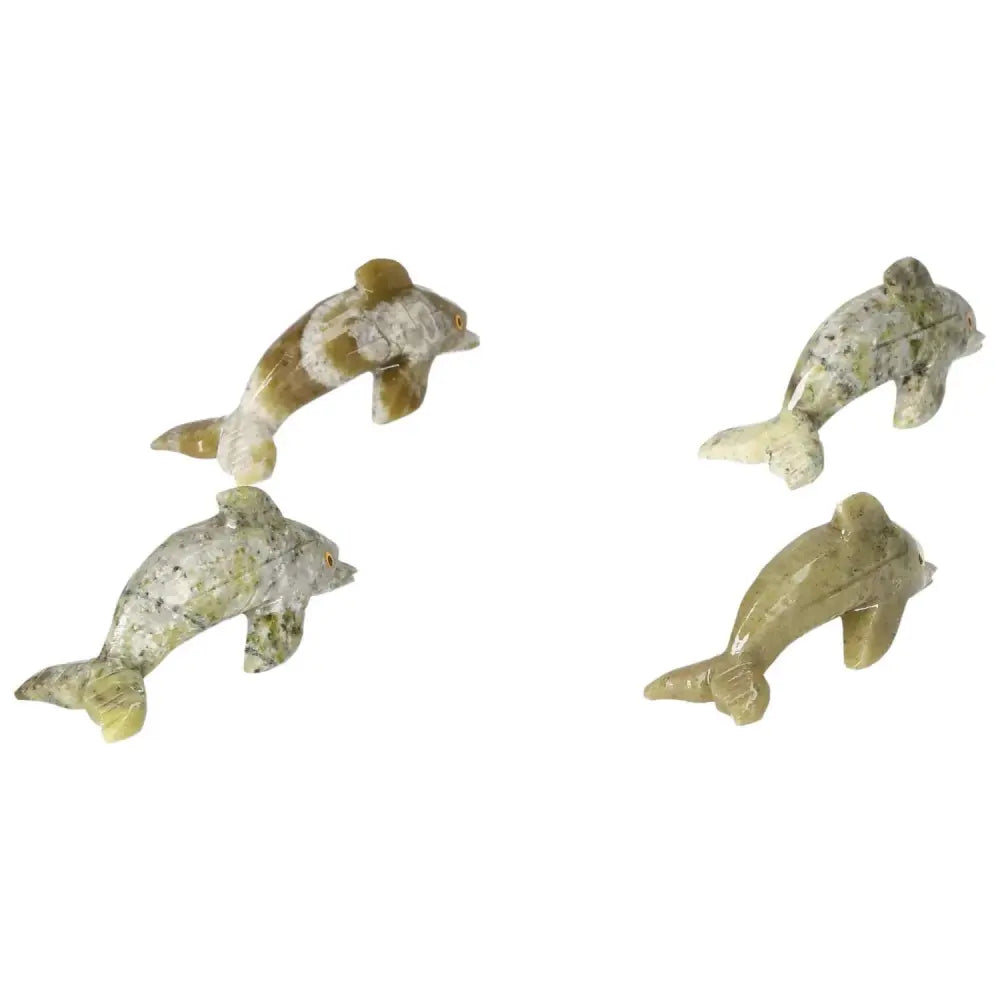 Carved Dolomite Dolphins from Sylvia Crystals, showcasing unique patterns and calming metaphysical properties for home decor.