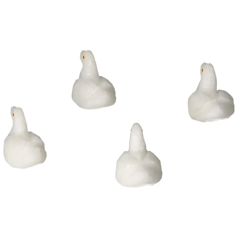 Set of four carved dolomite duck figurines for emotional balance and serenity, designed by Sylvia Crystals.