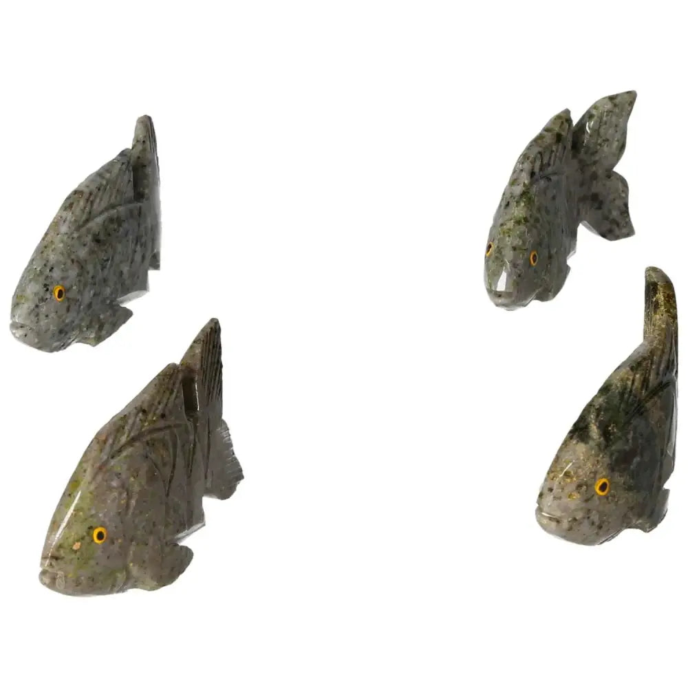 Carved Dolomite Fish sculptures by Sylvia Crystals, showcasing premium craftsmanship and grounding properties for emotional well-being.