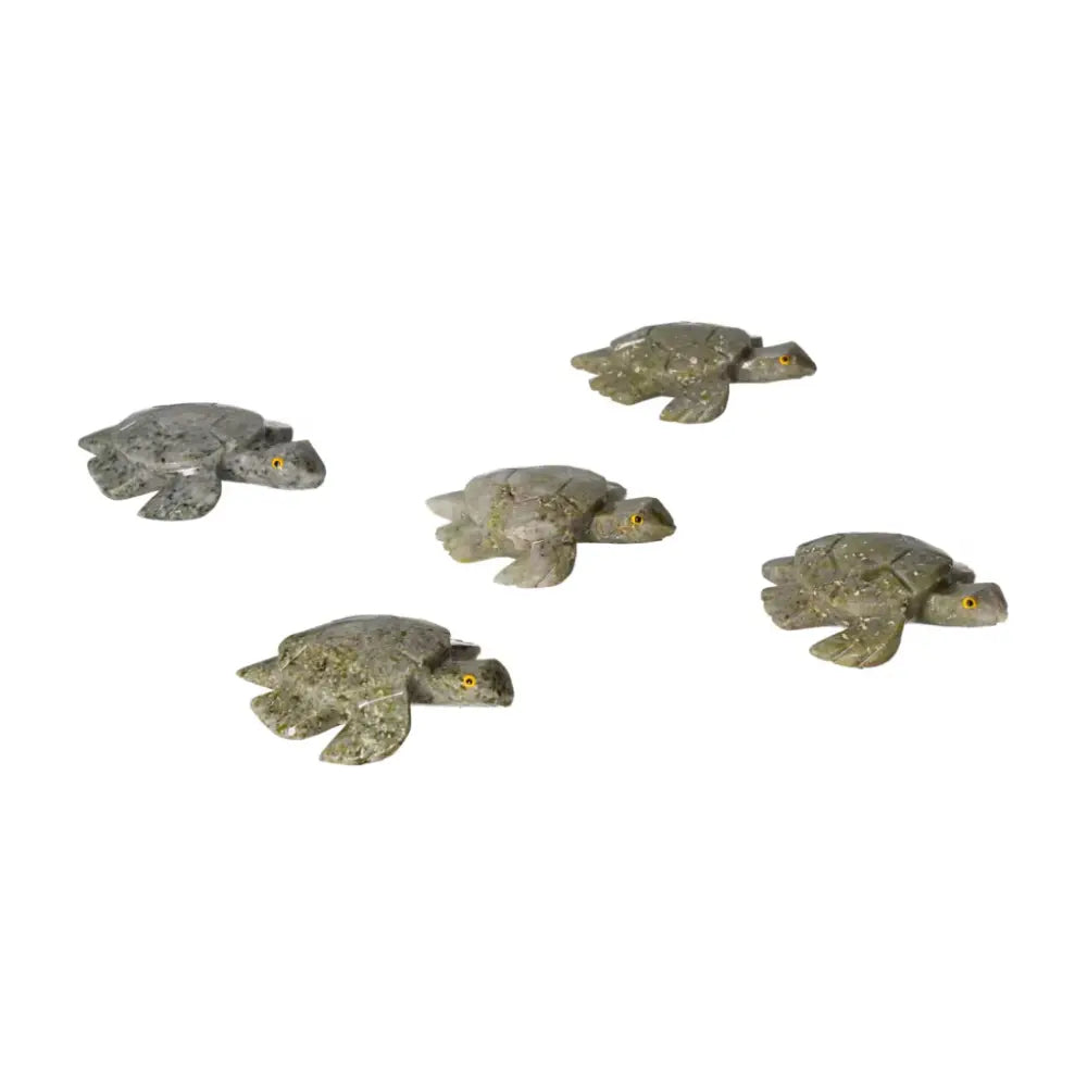 Five carved dolomite turtle figurines displayed, highlighting natural beauty and grounding properties for decor and emotional balance.