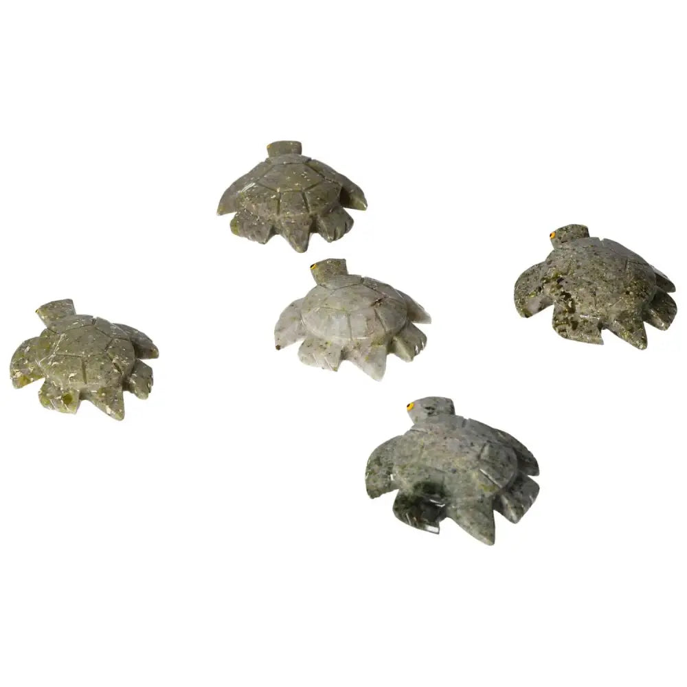 Collection of carved dolomite turtle figurines showcasing intricate details and natural hues.