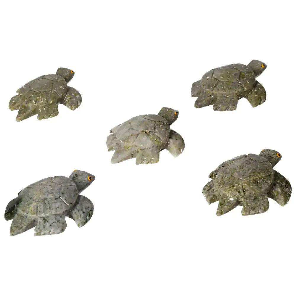 Five carved dolomite turtles, perfect for decor and emotional balance, showcasing natural beauty and grounding properties.