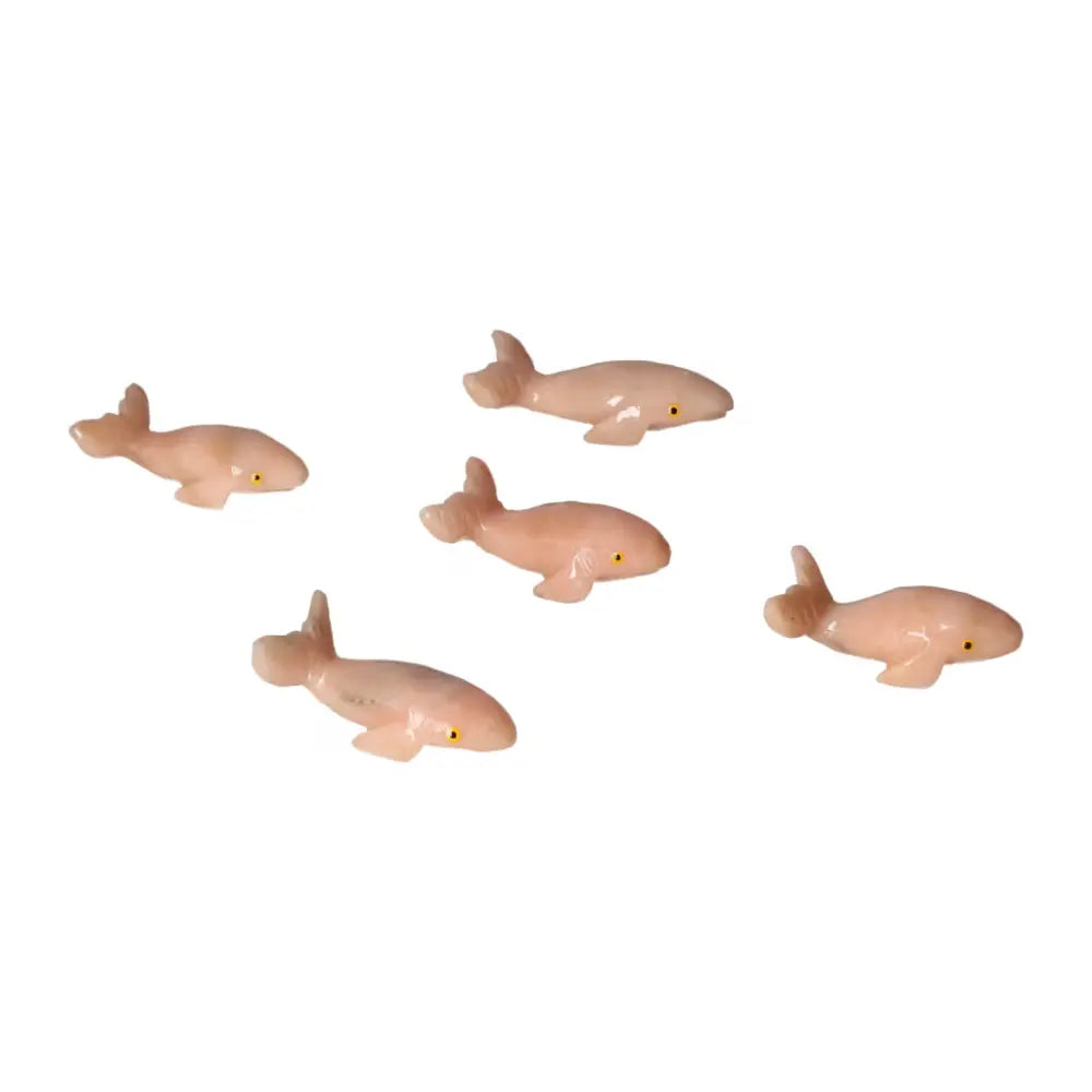 Set of carved dolomite whales showcasing exquisite craftsmanship and natural elegance, perfect for home or office decor.