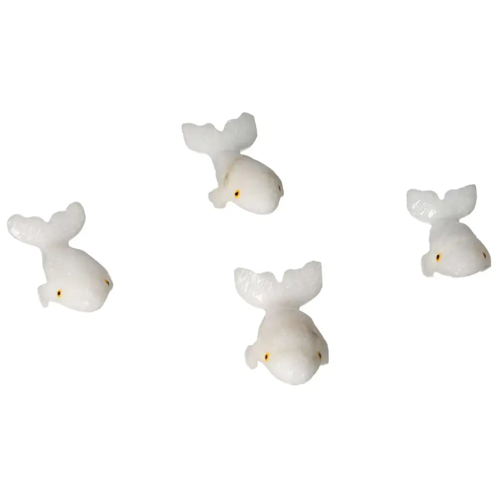 Carved Dolomite Whale figurines by Sylvia Crystals, showcasing intricate artistry and calming design, symbolizing peace and balance.