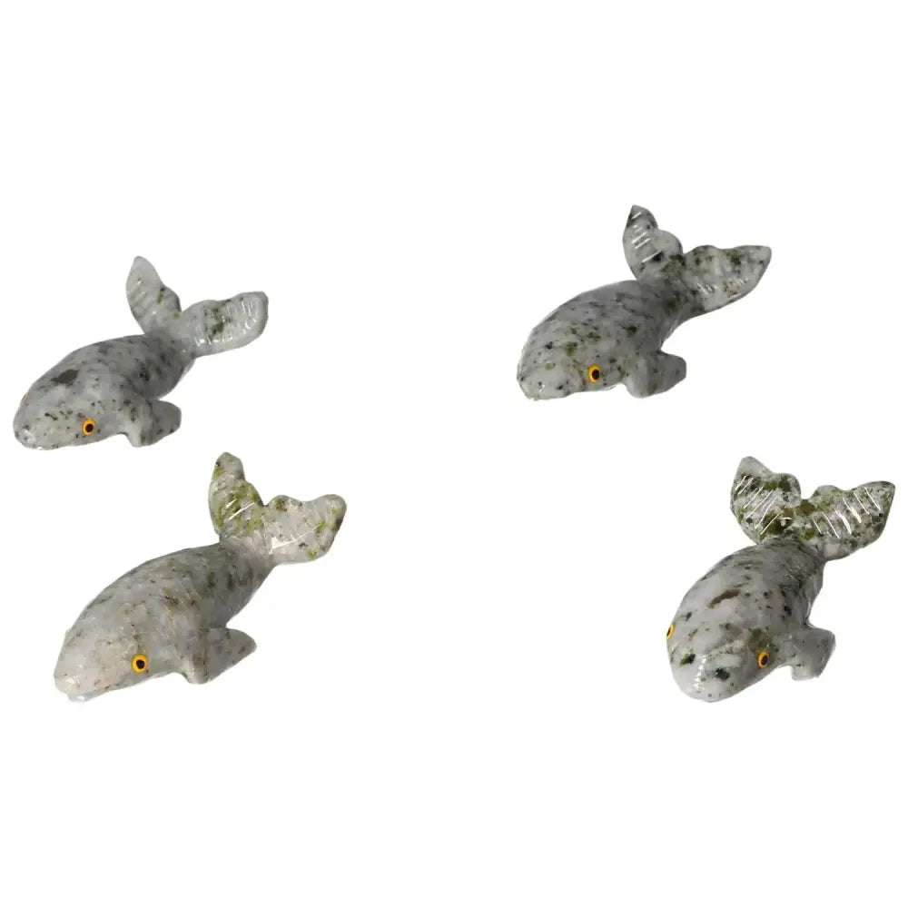 Carved dolomite whale sculptures, showcasing unique textures and calming properties, ideal for home decor from Sylvia Crystals.