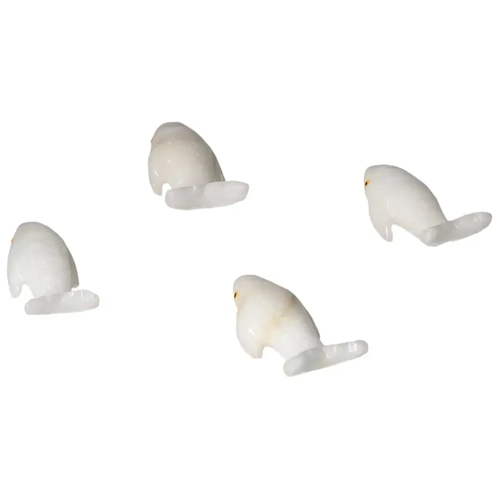 Carved Dolomite Whale artifacts on white background, symbolizing peace and emotional balance, crafted from quality dolomite.