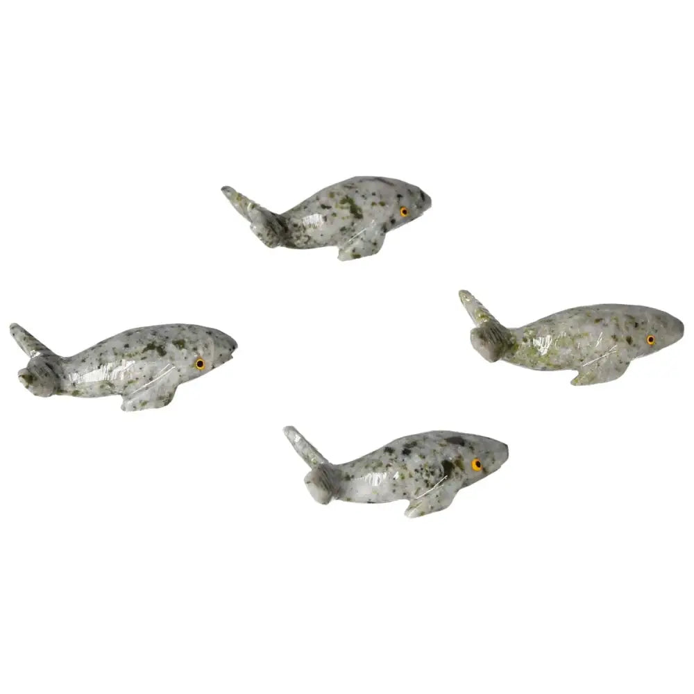 Handcrafted carved dolomite whales showcasing exquisite craftsmanship and natural dolomite's calming properties.