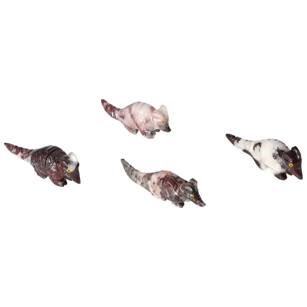 Four carved magnesite armadillo sculptures with unique patterns, enhancing spiritual and decorative collections.