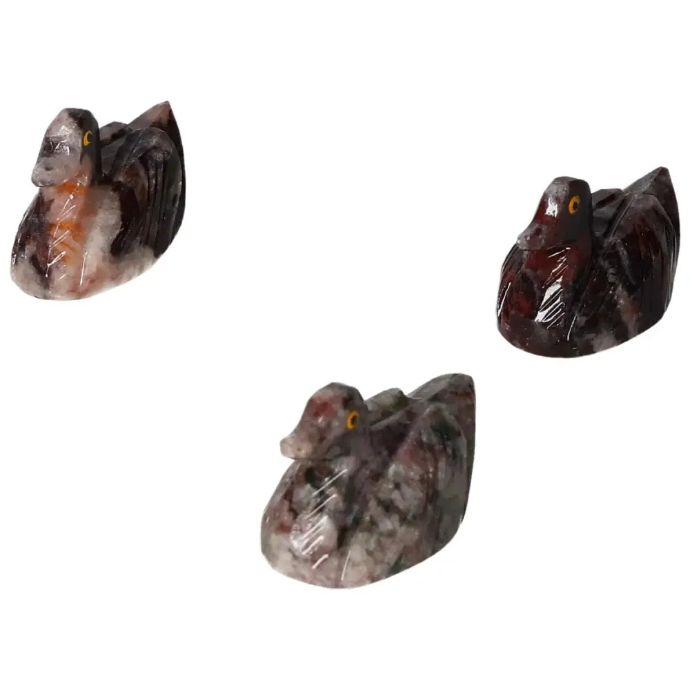 Three carved magnesite duck figurines showcasing unique textures and colors, ideal for enhancing spiritual and aesthetic spaces.