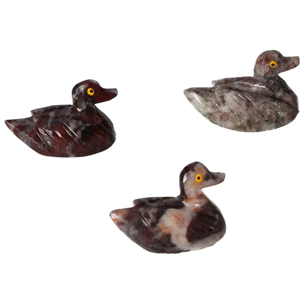 Three carved magnesite duck sculptures showcasing intricate details and serene elegance, ideal for enhancing spiritual environments.