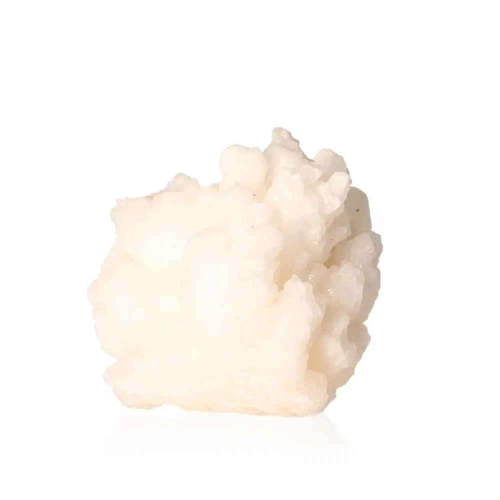 White cave calcite stalactite cluster with intricate texture showcasing natural mineral formation.