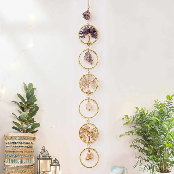 Chakra gemstone wall hanging with Tree of Life design, featuring vibrant stones for energy flow and balance, against a serene backdrop.