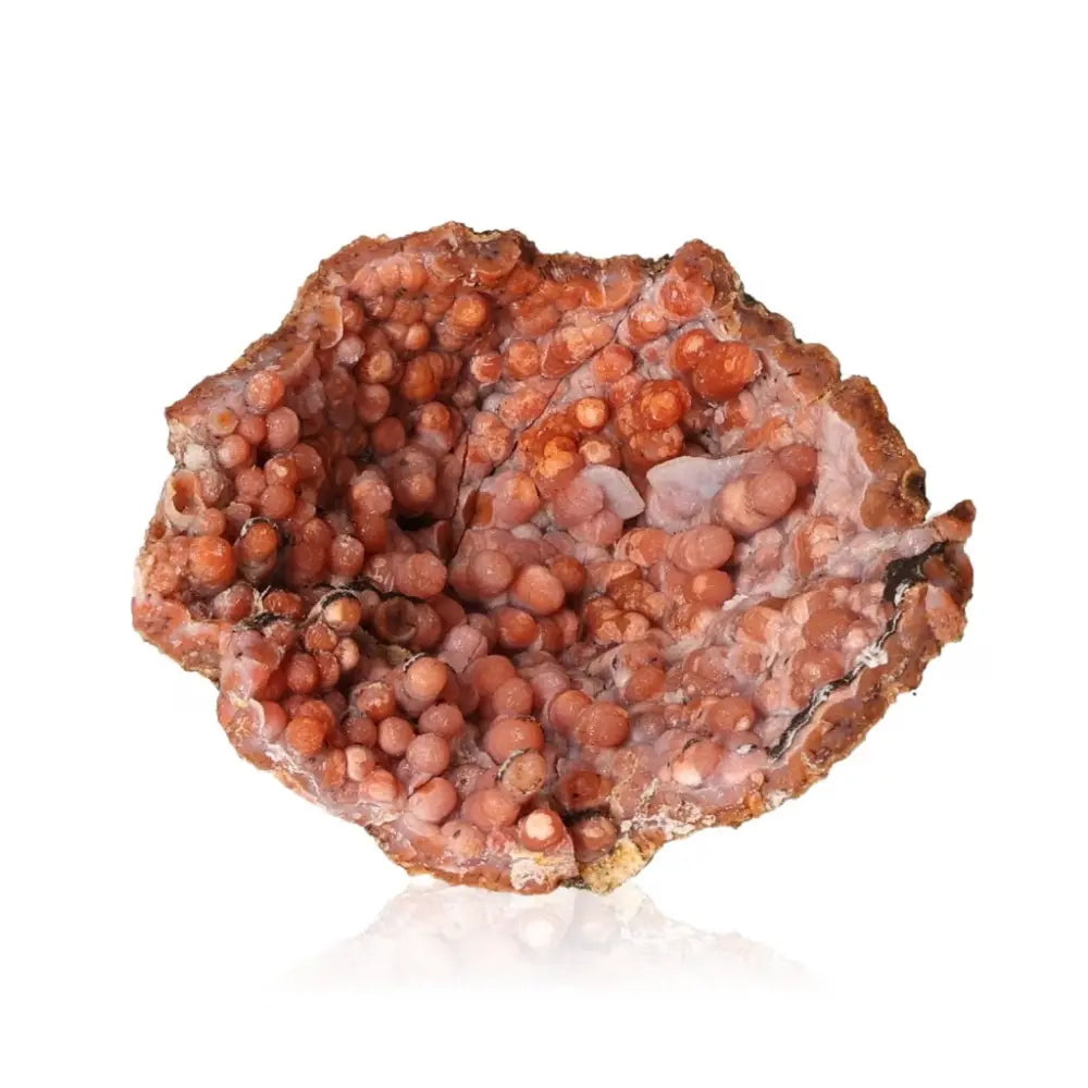 Close-up of a red chalcedony stalactite crystal, showcasing its intricate surface texture and unique formation.