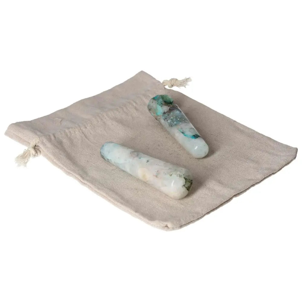 Chrysocolla wands on a natural canvas bag, showcasing their calming blue-green hues for effective communication and emotional balance.