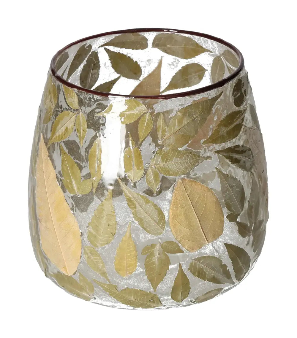 Clear candle holder with intricate leaf motif design showcasing artisanal craftsmanship.