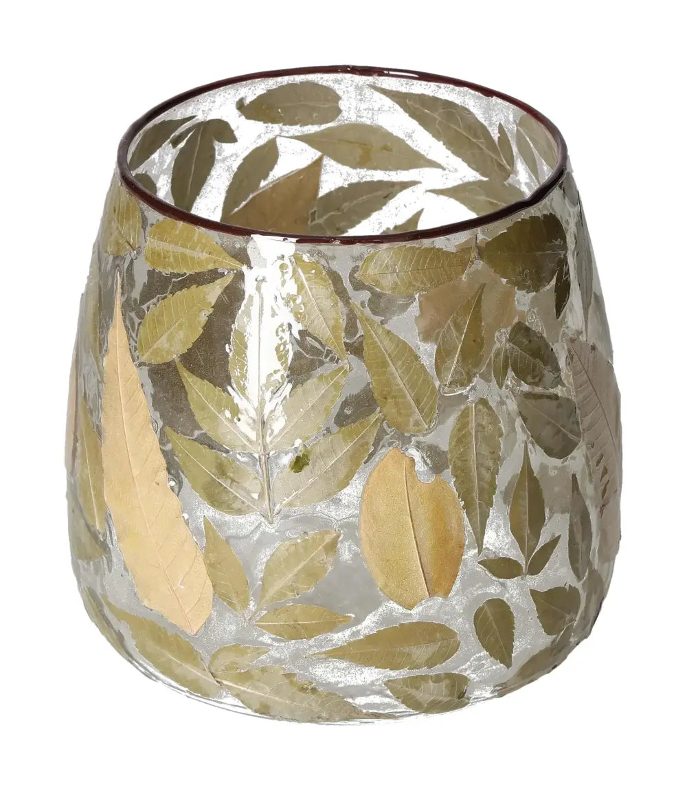 Clear candle holder with leaf motif in gold and green on transparent glass.