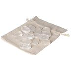 Clear Quartz Thumb Massager stones on beige pouch, ideal for stress relief and energy balance by Sylvia Crystals.