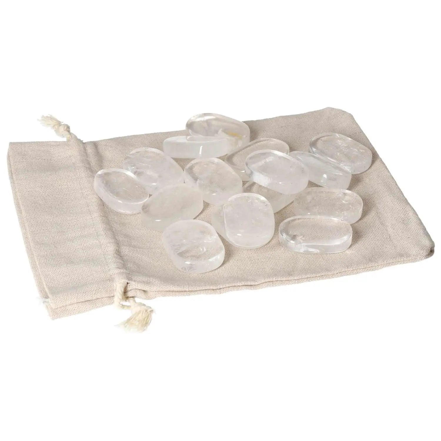 Clear Quartz Antistress Thumb Massagers resting on a soft beige pouch.