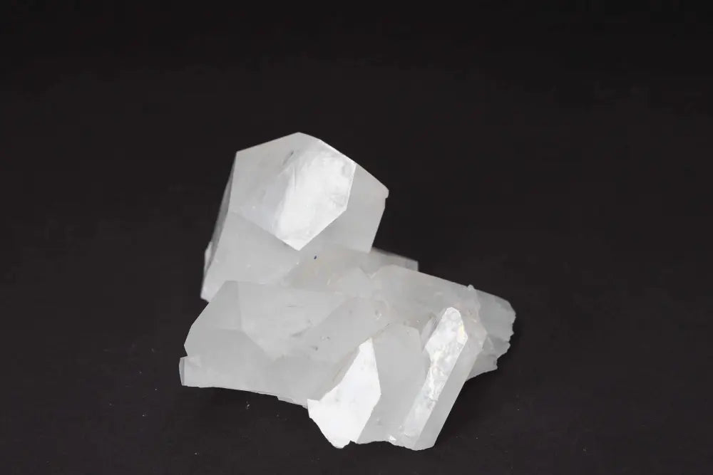 Clear Quartz Cluster showcasing pure energy and high vibrational clarity on a black background.