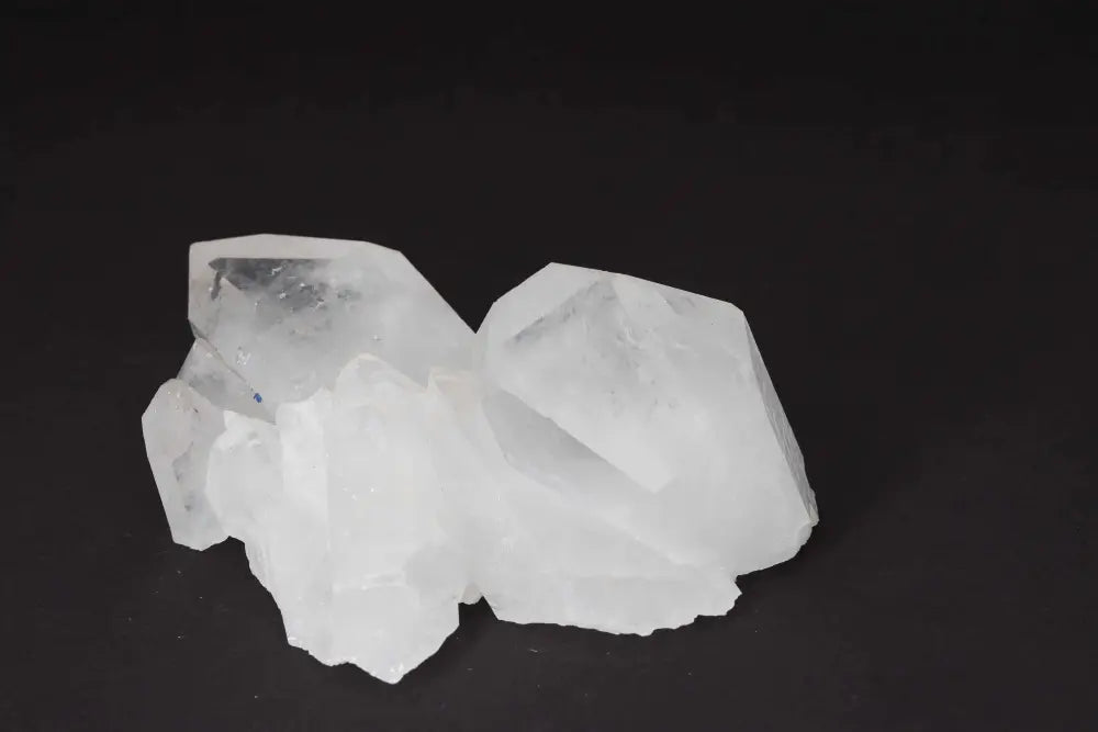 Clear Quartz Cluster emitting pure energy and clarity, features multiple crystal points on a shared matrix, ideal for energy amplification.
