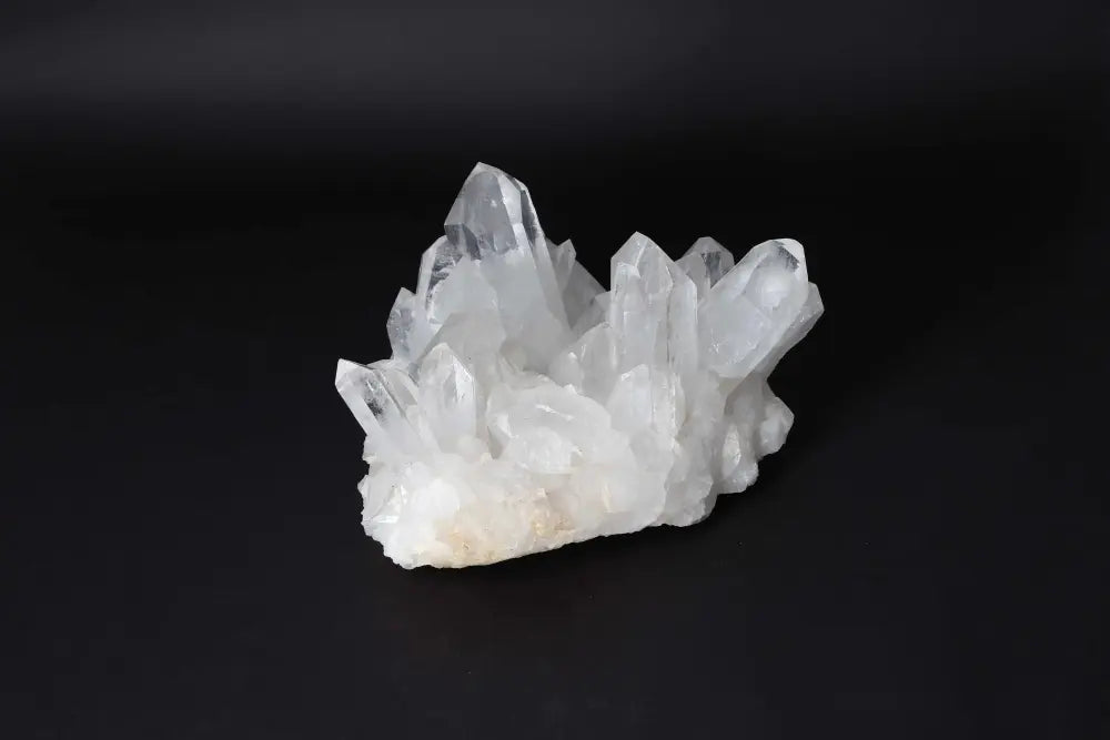 Clear Quartz Cluster with pure energy and clarity, featuring multiple crystal points on a matrix, amplifying vibrational energy.
