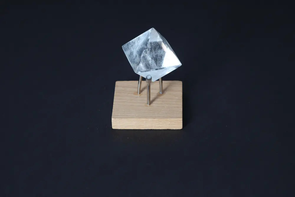 Clear Quartz Double Pyramid 3 cm on display stand; powerful purification stone for harmonizing body, mind, and energy.