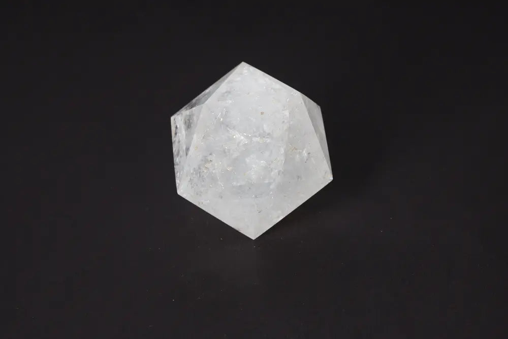 Clear Quartz geometric sphere, 8 cm, for purification and harmonizing energy, shown on a dark background.