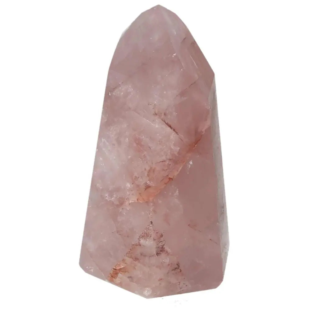 Rose quartz crystal tower on white background, showcasing natural patterns and soft pink hues.