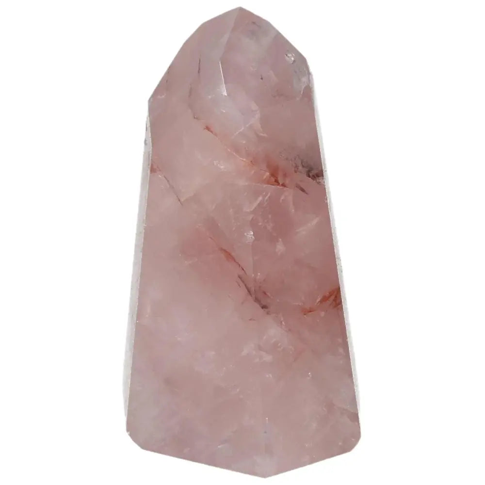 Rose quartz crystal with subtle pink hues on a white background, known for its calming and healing properties.