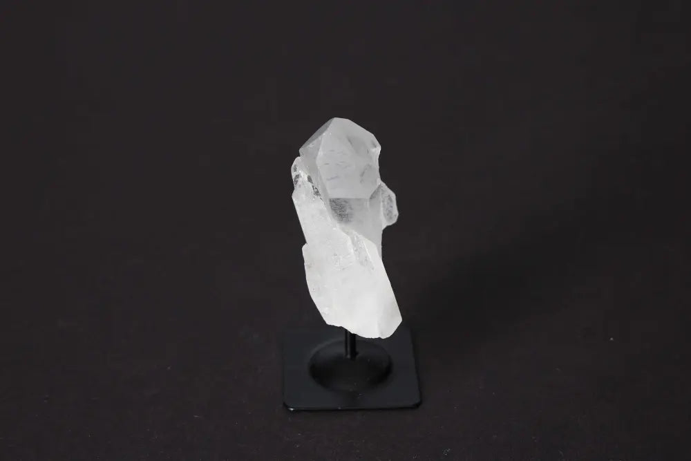Clear Quartz on Metal Stand, enhancing clarity and elegance. Premium crystal from Sylvia Crystals offering spiritual harmony and healing.