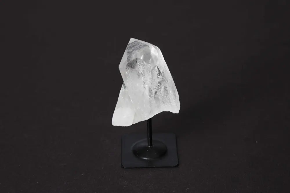 Clear Quartz on metal stand from Sylvia Crystals; enhances clarity, amplifies energy, adds spiritual elegance as a decorative piece.