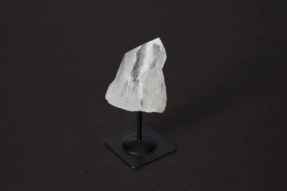 Clear Quartz on metal stand, showcasing premium crystal elegance and spiritual harmony from Sylvia Crystals.