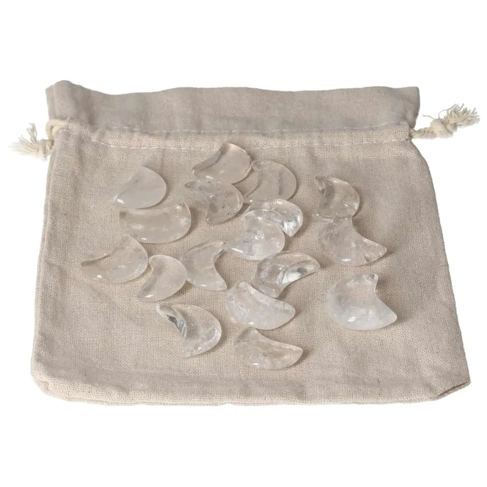 Clear quartz small moon stones on fabric pouch for purification and negative energy dispersal