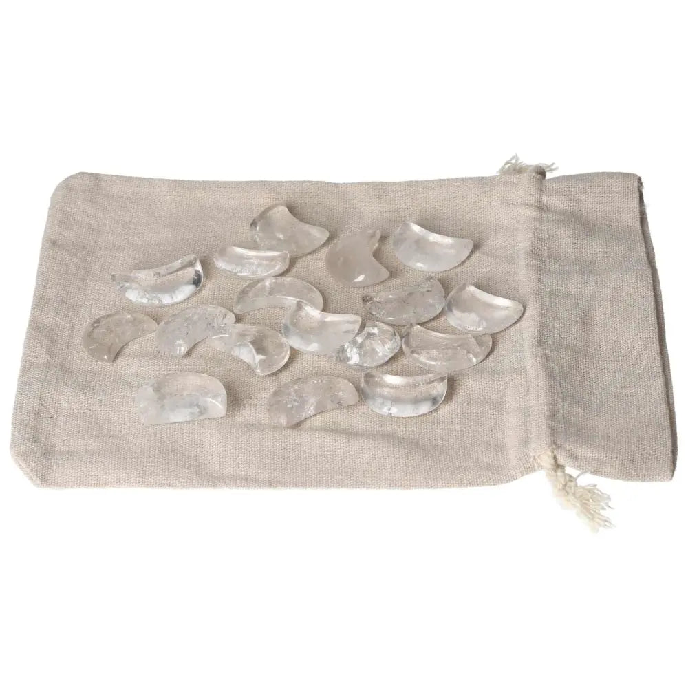 Clear Quartz small moon stones on a linen bag for purification and harmonizing energy, ideal for neutralizing negative vibrations.