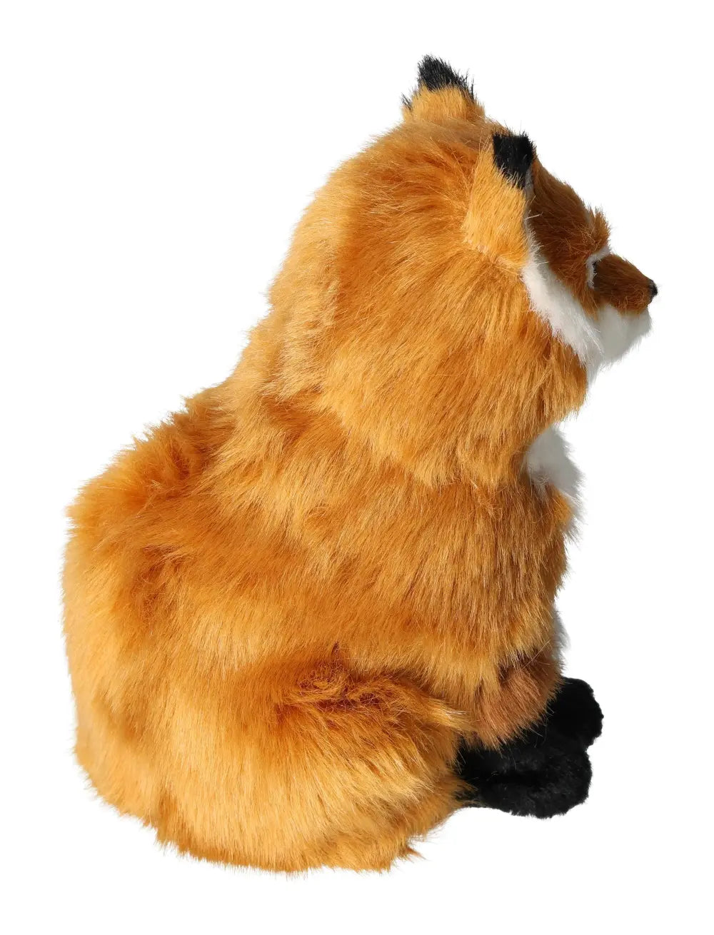 Plush fox toy sitting, showcasing its fluffy orange fur and black paws.