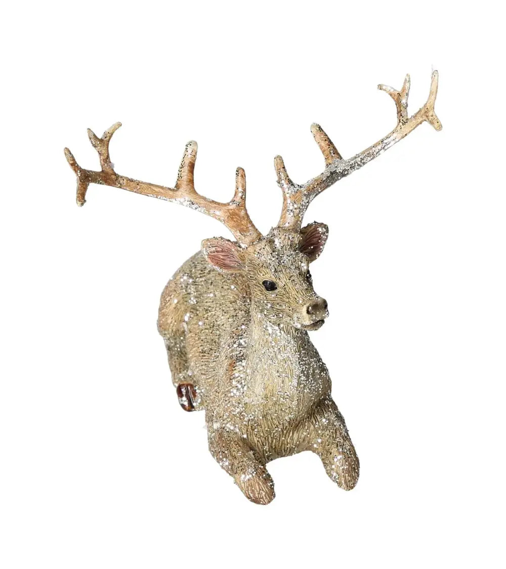 Deer with glitter finish made of poly champagne, lying pose, by Sylvia Crystals. Elegant and luxurious decorative piece.