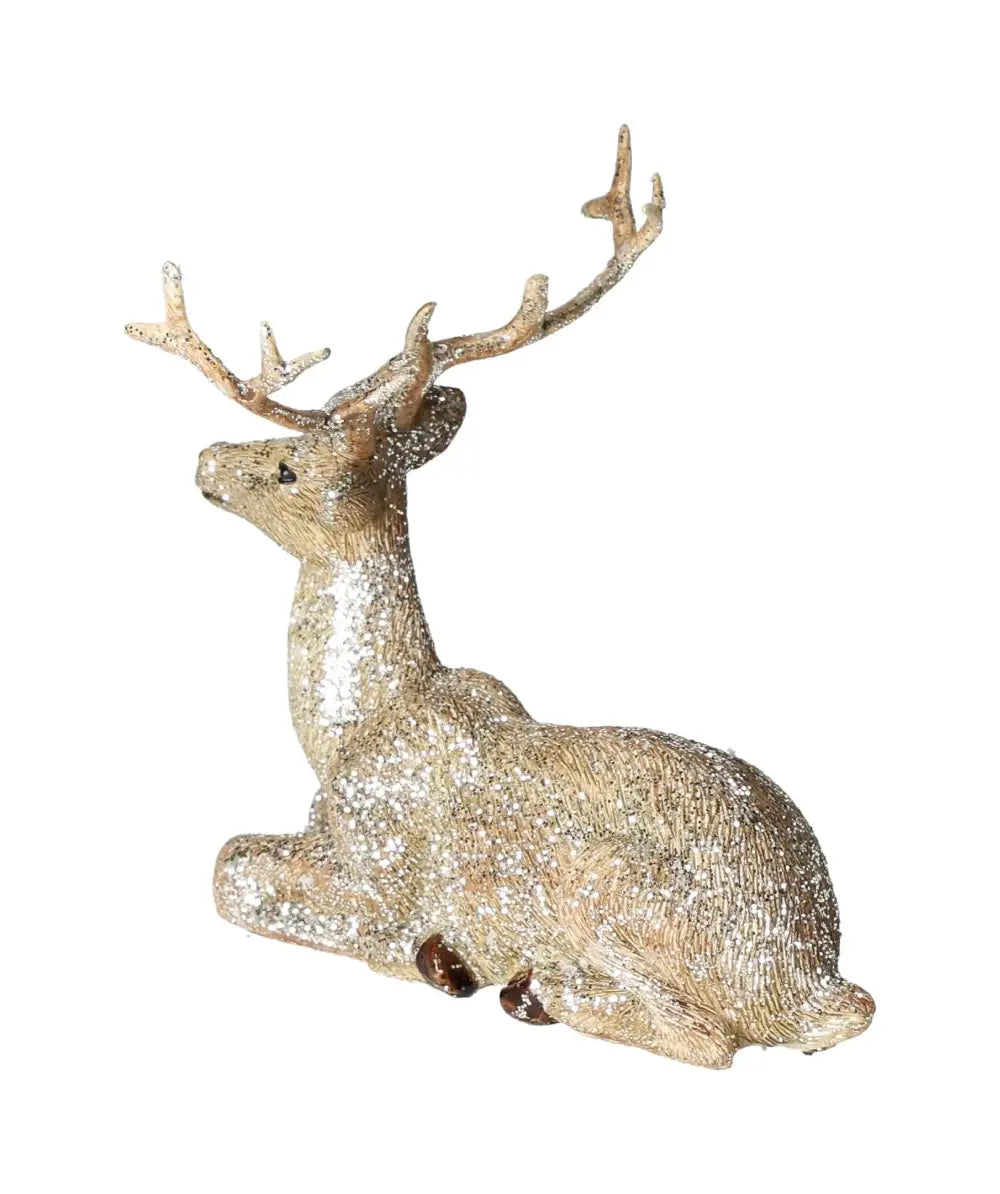 Elegant glitter deer figurine in champagne color, crafted from poly material, lying down with graceful antlers, by Sylvia Crystals.