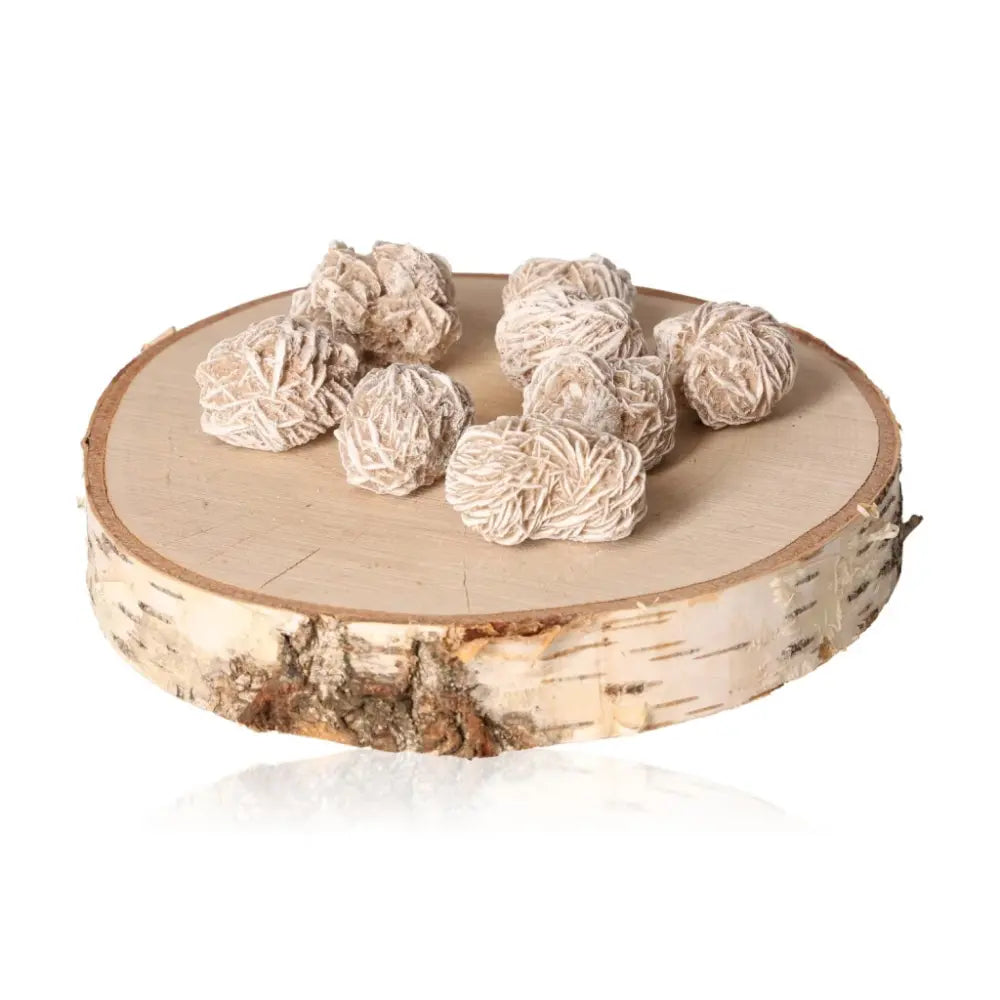 Desert Rose stones by Sylvia Crystals on a rustic wooden base, ethically sourced from Morocco, showcasing natural beauty and elegance.
