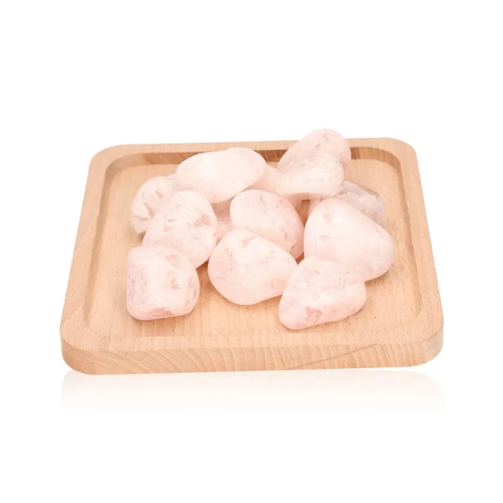 Smooth Emma Eggs on wooden tray, natural river-stones from New Zealand, promoting balance and harmony.