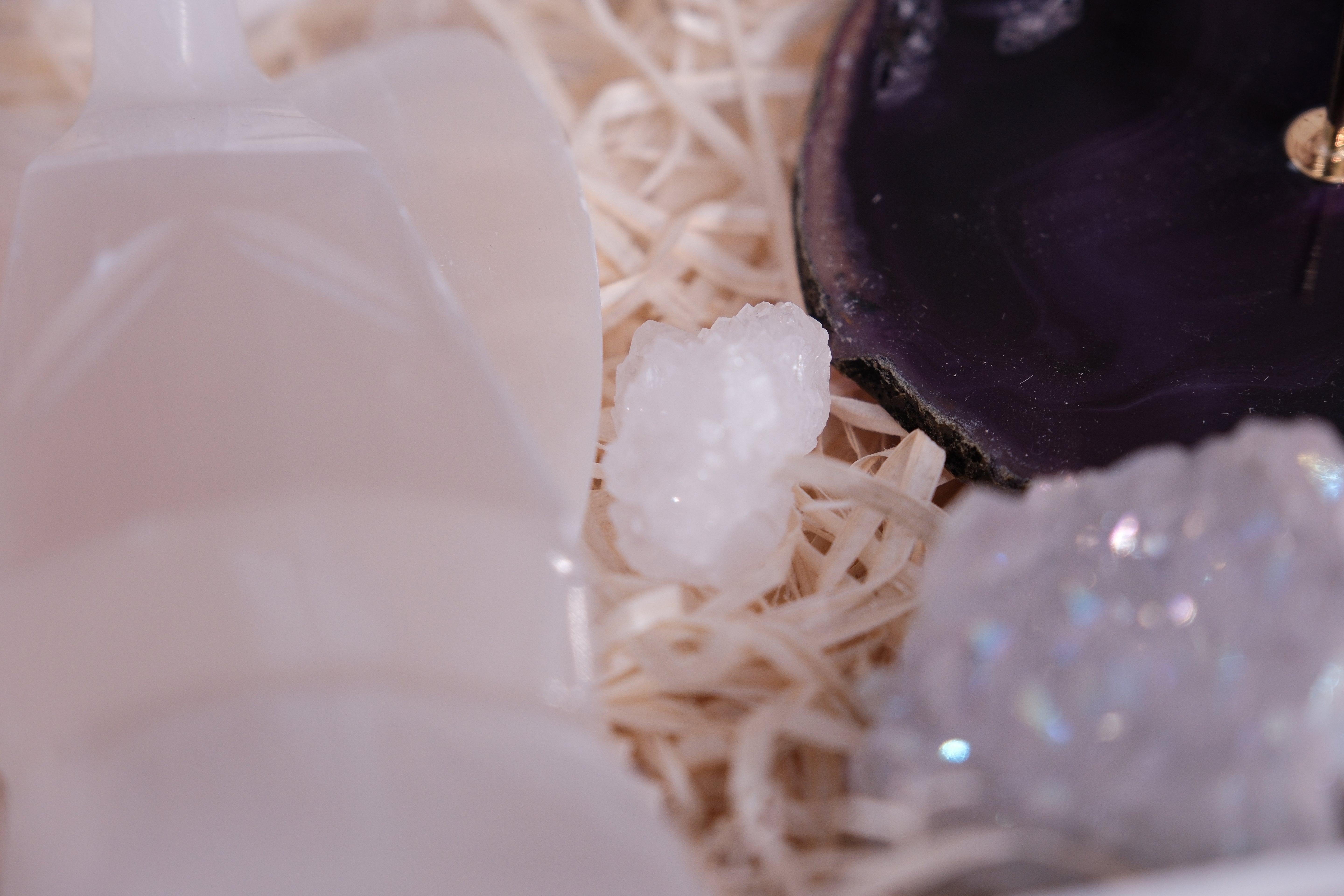 Hand-selected crystals in a Christmas gift box, promoting peace, beauty, and positive energy in a serene arrangement.