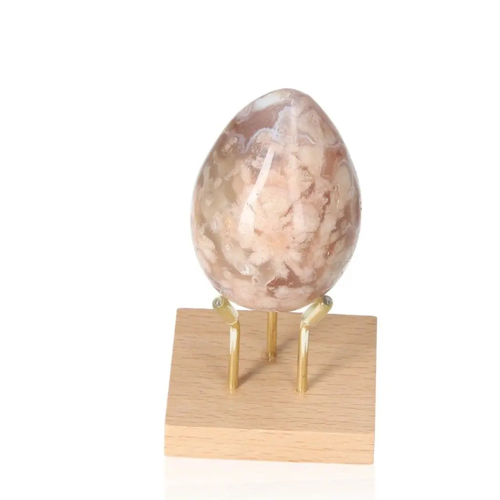 Flower Agate Egg on stand showcasing blossom patterns for growth and healing.