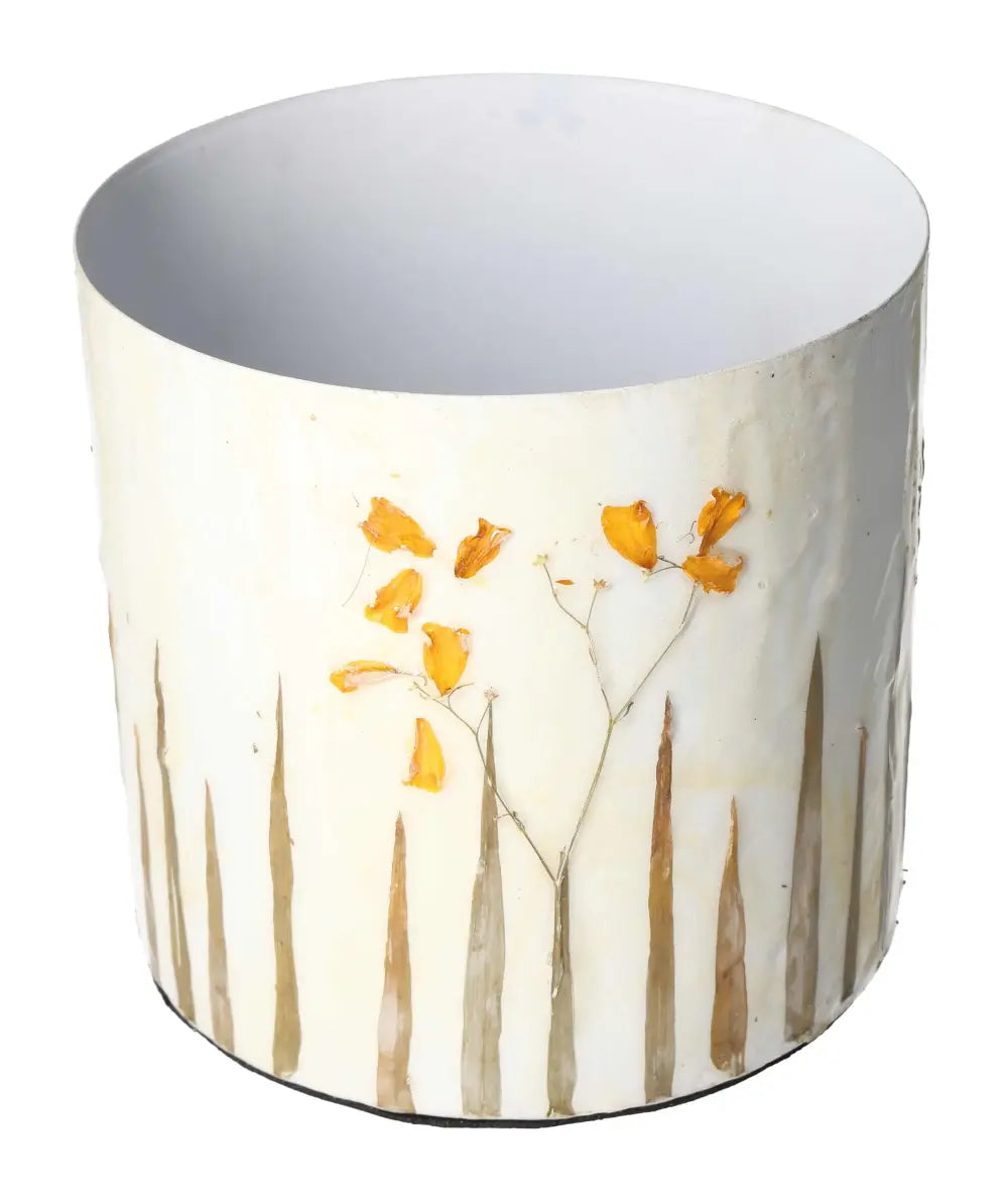 Elegant planter featuring a delicate flower motif design with neutral tones, perfect for enhancing modern living spaces.