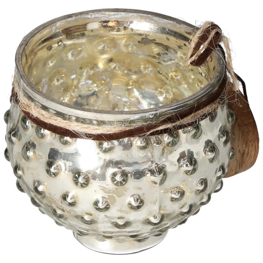 Elegant glass lantern with textured surface and wooden heart pendant, offering a blend of luxury and tranquility for home decor.