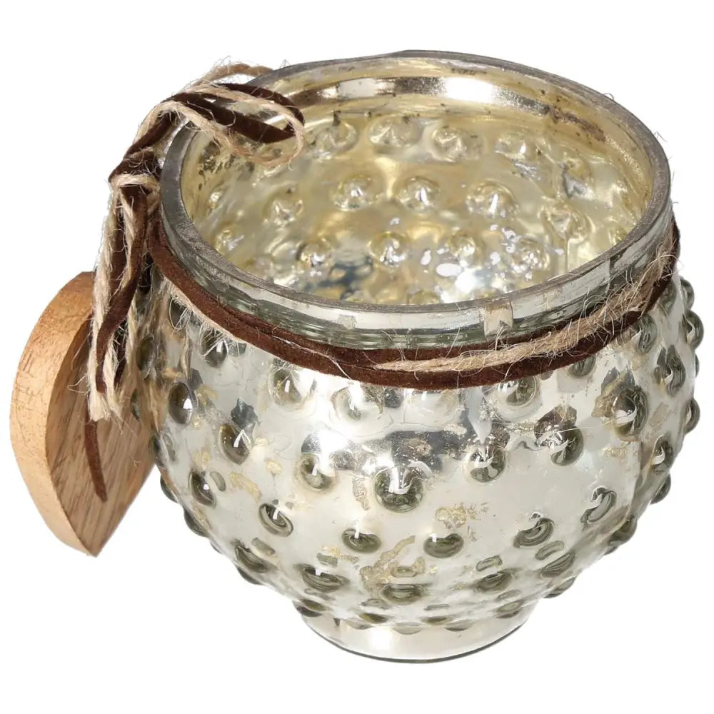 Glass lantern with wooden heart pendant, featuring a textured silver finish, embodying elegance and spirituality for luxury decor.