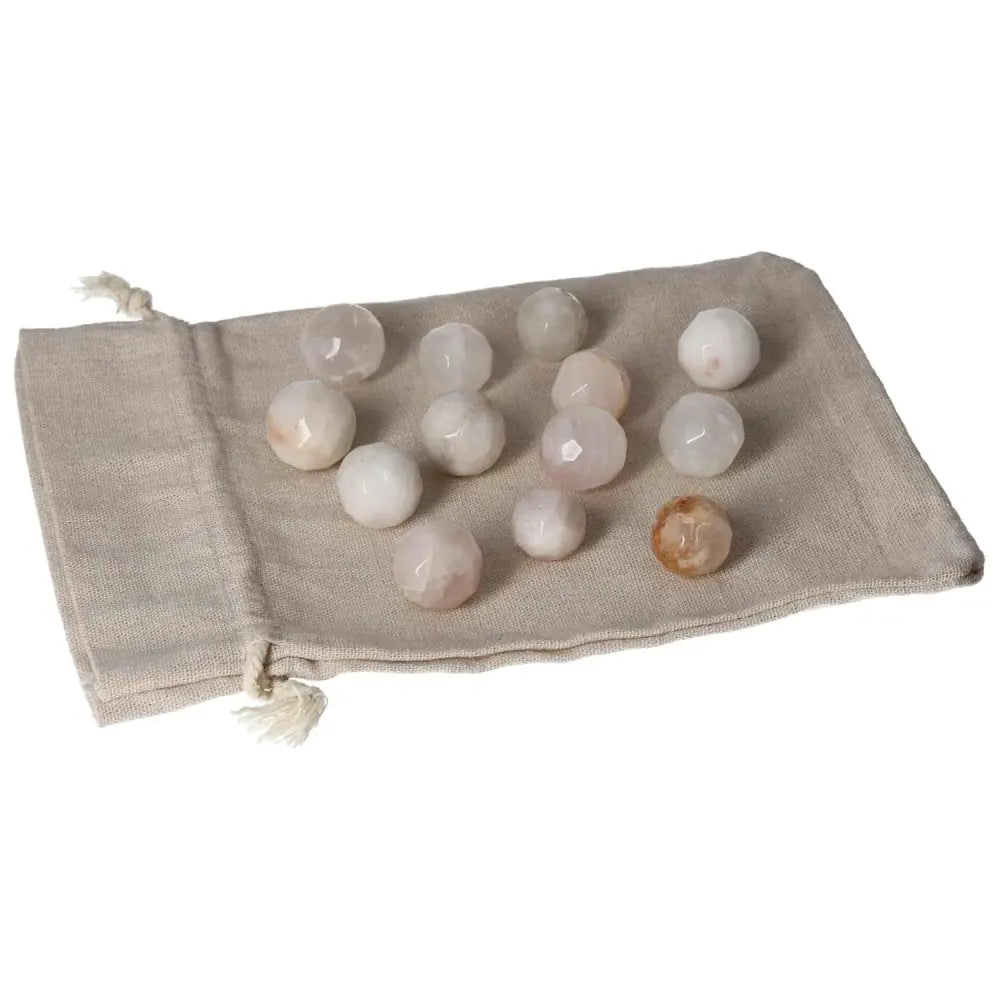 Golden Healer small geometric spheres on linen pouch for crystal healing.