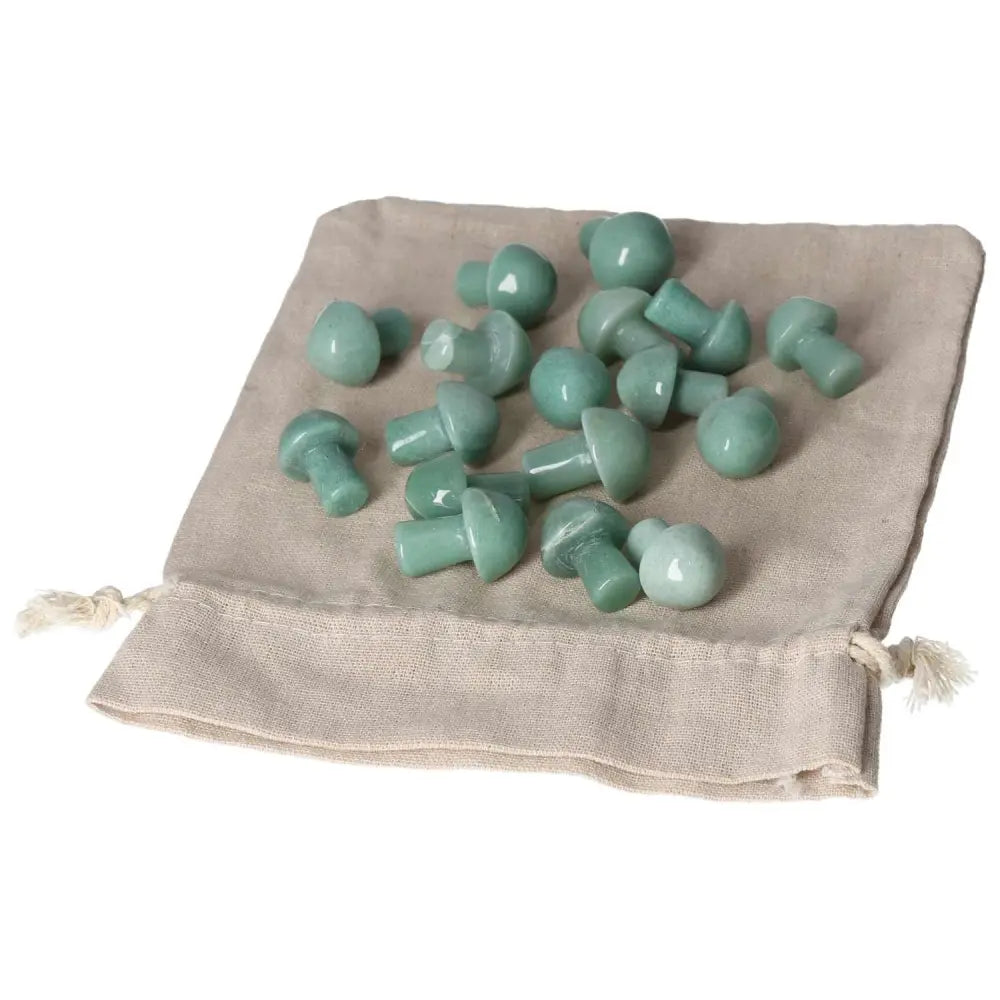 Green Aventurine small mushrooms on a beige pouch, symbolizing luck and prosperity, ideal for new beginnings and inner peace.