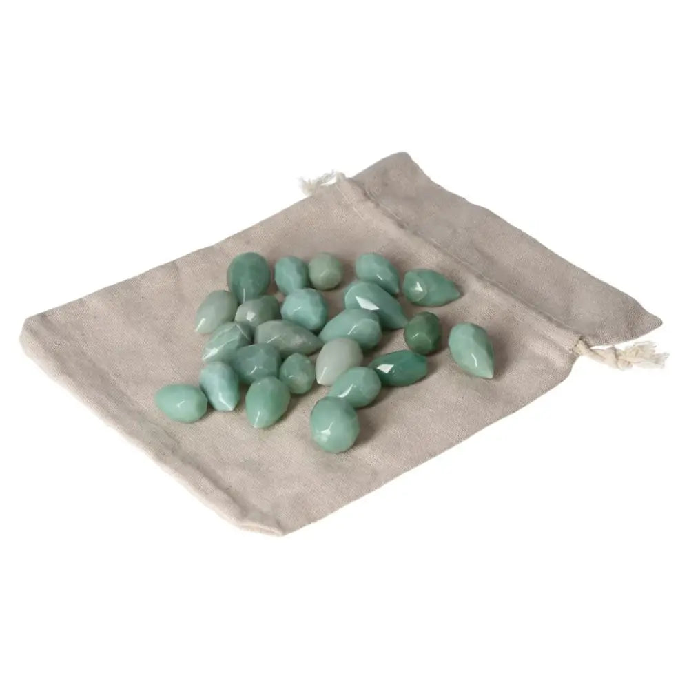 Green Aventurine stones on a cloth bag, boosting confidence and prosperity. Ideal for positive new beginnings and inner peace.