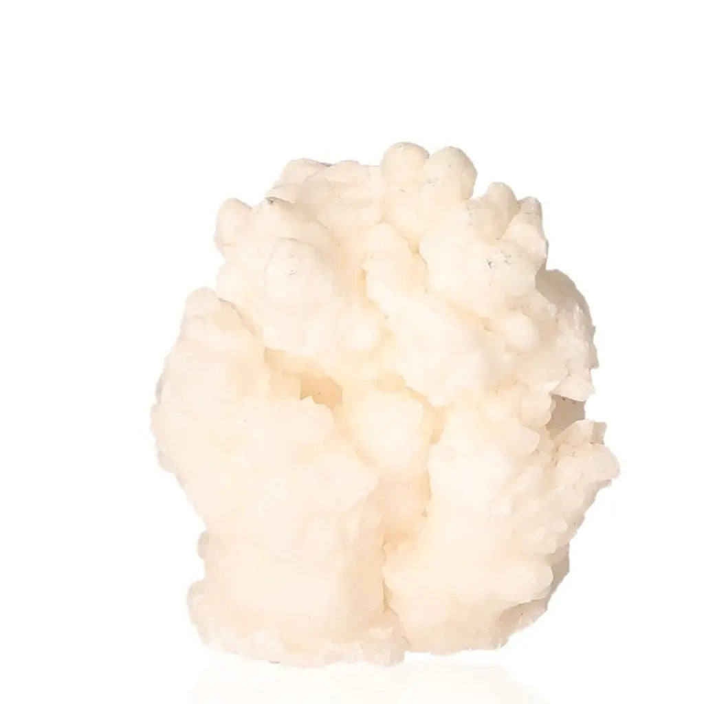 Ighoud Calcite Druze from Morocco, showcasing natural shapes and earthy tones, symbolizing grounding and spiritual growth.